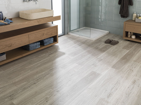 Waterproof wood-look SPC flooring used in an apartment bathroom interior
