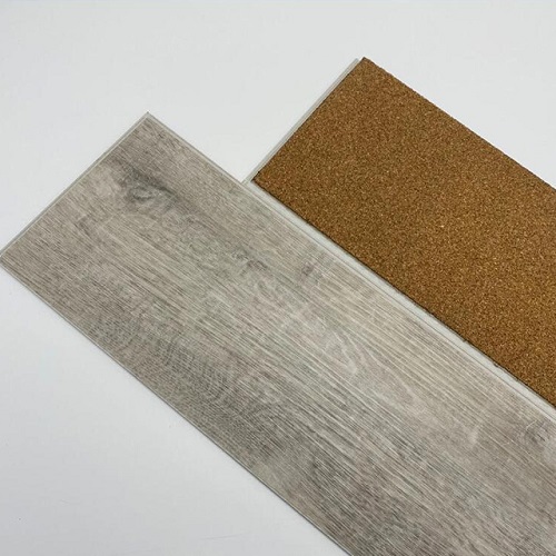 SPC flooring plank with cork acoustic underlayment backing