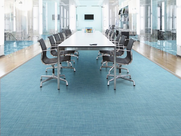 Commercial project vinyl flooring installed in a modern office meeting room